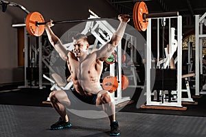 Muscular man lifting a barbell