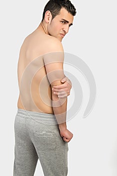 Muscular man with muscle pain