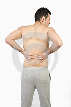 Muscular man with muscle pain