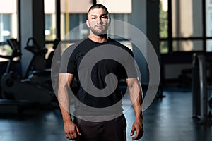 Muscular Man Posing In Black T-shirt