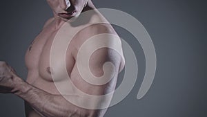 Muscular man posing in studio.