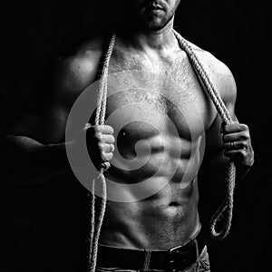 Muscular man with rope