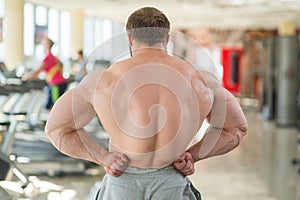 Muscular man's back.