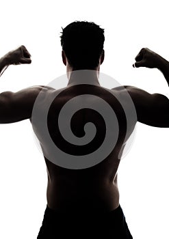 Muscular man's back in silhouette