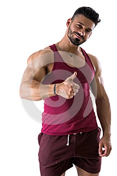 Muscular man shirtless doing thumb up sign for OK