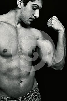 muscular man showing his biceps