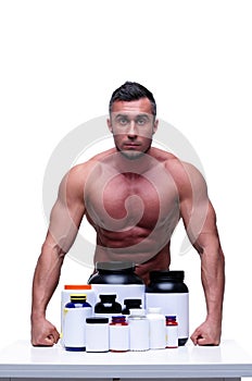 Muscular man with sports nutrtion
