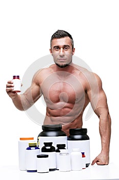 Muscular man with sports nutrtion