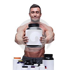 Muscular man with sports nutrtion