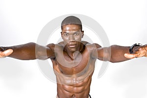 Muscular man stretching arms