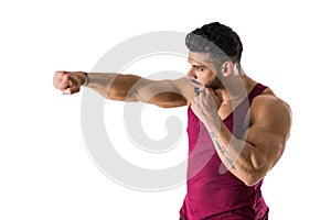 Muscular man throwing punch