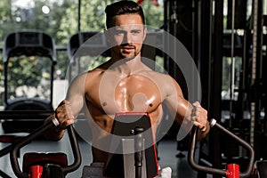 muscular man training in gym