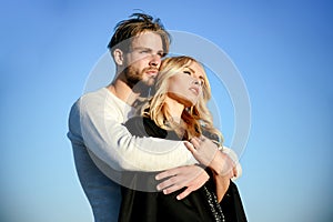 Muscular man and woman with long blond hair, love.