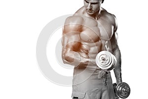 Muscular man working out doing exercises with dumbbells at biceps, strong male abs, isolated over white