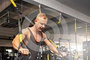 Muscular man working out in gym doing exercises,Exercise for triceps in the gym. strong male naked torso abs