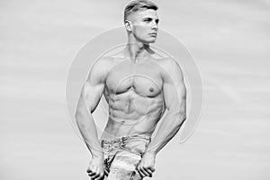 Muscular masculine guy look confident. Man muscular torso stand confidently. Sport and bodycare. Man sexy muscular bare