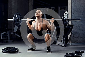 Muscular men lifting deadlift In the gym