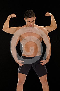 Muscular men showing their muscles