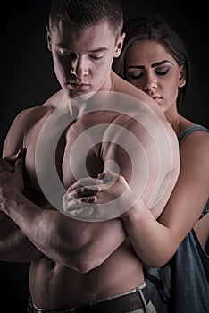 muscular naked man and female hands