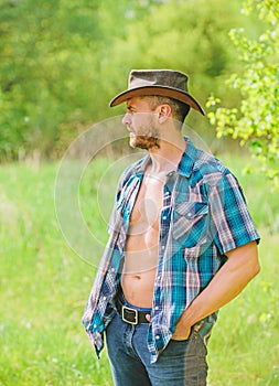Muscular ranch man in cowboy hat. sexy farmer relax. farming and agriculture cultivation. time for break. Eco farm