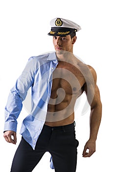Muscular shirtless male sailor with marine hat