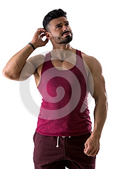 Muscular shirtless man unsure or confused