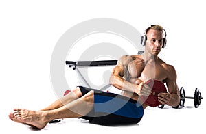 Muscular shirtless young man exercising with weights isolated