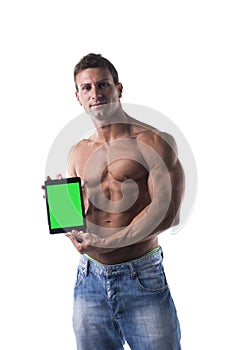 muscular shirtless young man holding a blank tablet PC