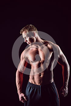 Muscular, strong and man isolated on black background