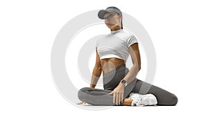 Muscular woman after abs workout laying on the floor