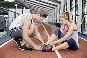 Muscular woman having an ankle injury