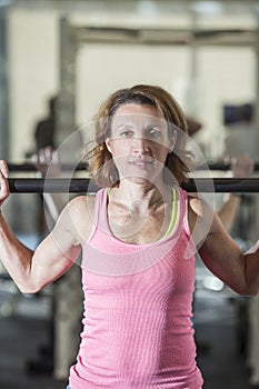 Muscular woman lifting weights