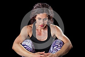 Muscular Woman Sitting Looking Down Contemplative