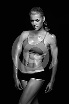 Muscular woman, trained female body