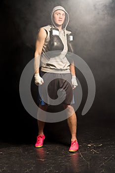 Muscular young boxer preparing for a fight