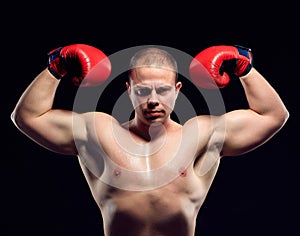 Muscular young caucasian boxer wearing boxing