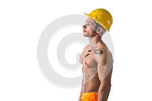 Muscular young construction worker shirtless