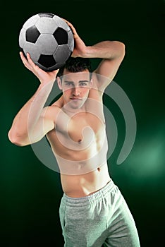 Muscular young man with balloon