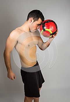 Muscular young man with balloon