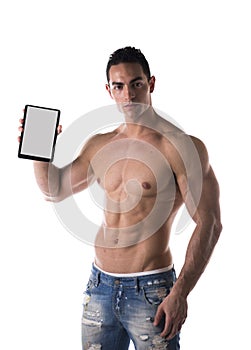 Muscular young man holding a blank tablet PC