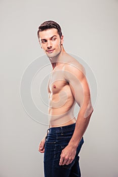 Muscular young man looking away