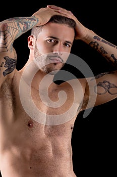 Muscular young man with many tattoos, dragan style