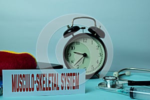 Musculo-Skeletal System Planning on Background of Working Table with Office Supplies. photo