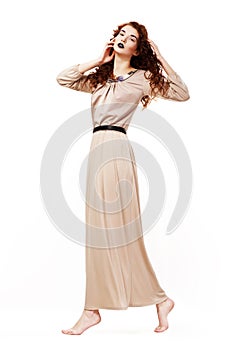 Muse. Serene Barefoot Frizzy Redhead Woman in Toga photo