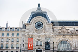 Musee d`Orsay or Orsay museum building facade with clock in a cloudy day in Paris, France