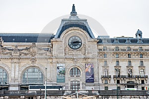 Musee d`Orsay or Orsay museum building facade with clock in a cloudy day in Paris, France