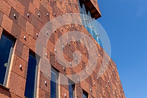 Museum aan de Stroom MAS Striking, red, sandstone museum details of the hand on the facade.