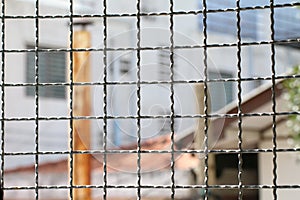 Mushroom barbed wire cage inside detention Within steel cage, nick iron net wall wire metal square grid fence to prevent photo