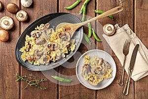 Mushroom and cheese pasta. Farfalle with cremini and green pea with ingredients