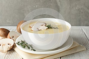 Mushroom cream soup on wooden background